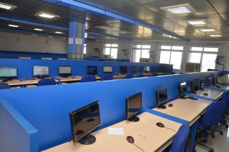 Desktop computers arranged at workstations in an ISM Ranchi computer laboratory