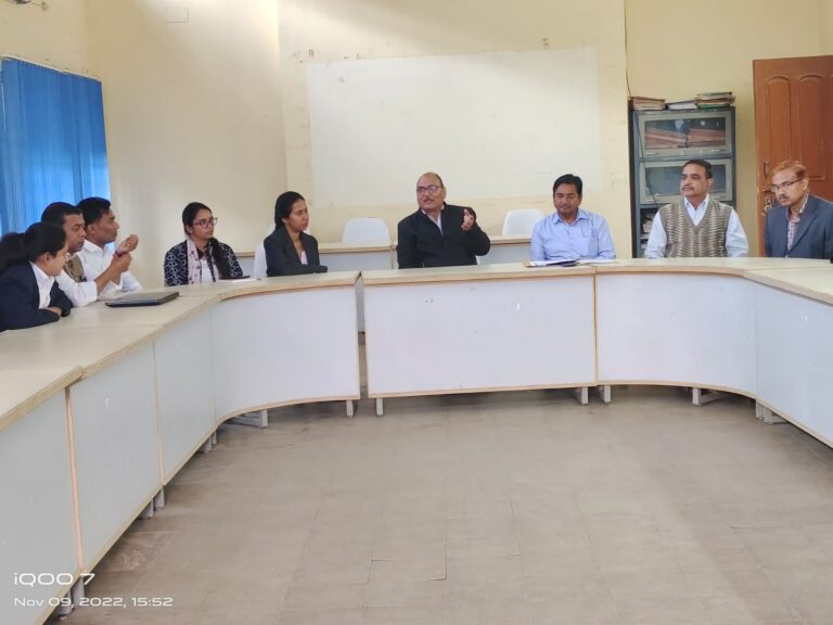 Panellists seated behind a curved desk during an ISM Ranchi academic event