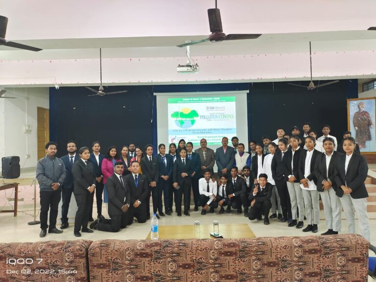 Students and faculty posing together on an ISM Ranchi event stage