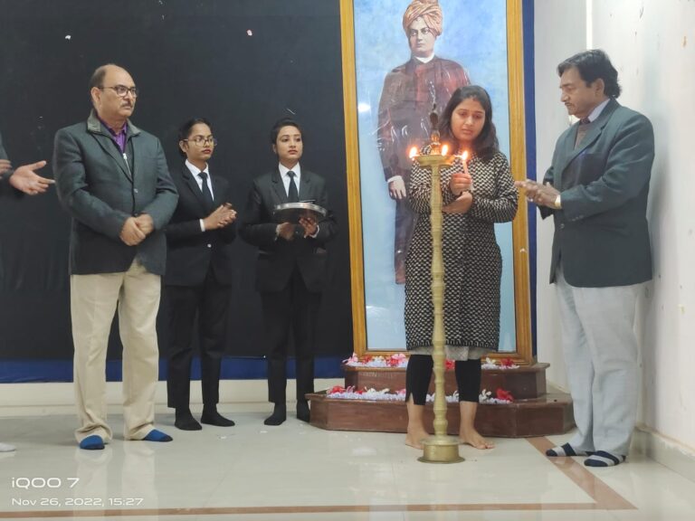 Guests lighting a ceremonial lamp on an ISM Ranchi stage