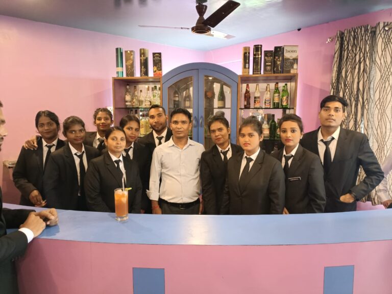 Students in formal uniforms posing with faculty in an ISM Ranchi classroom