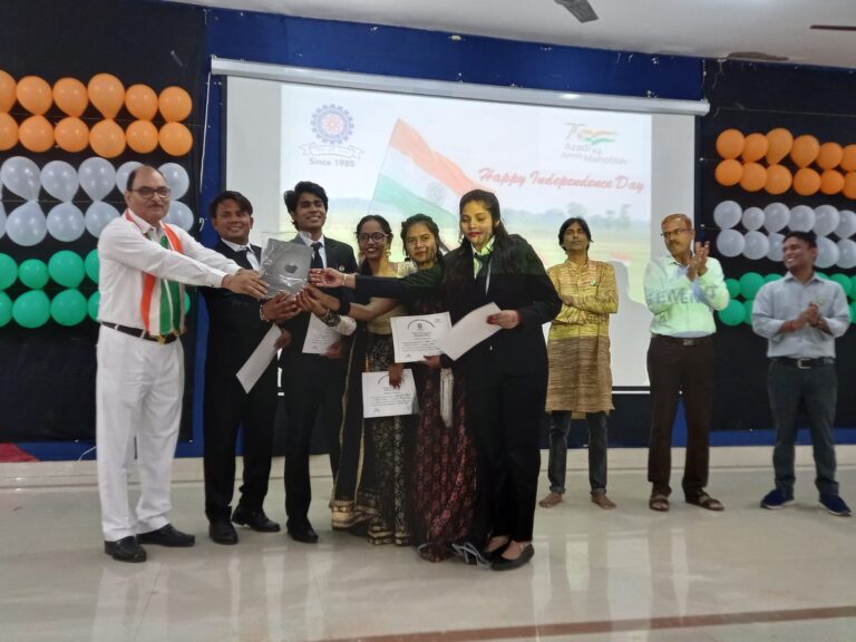 Students receiving certificates on stage during an ISM Ranchi event