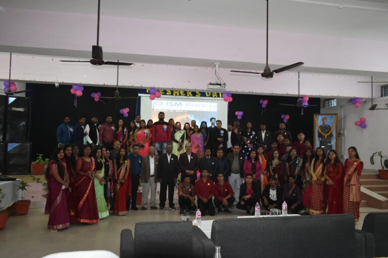 A large group posing together in an ISM Ranchi event hall