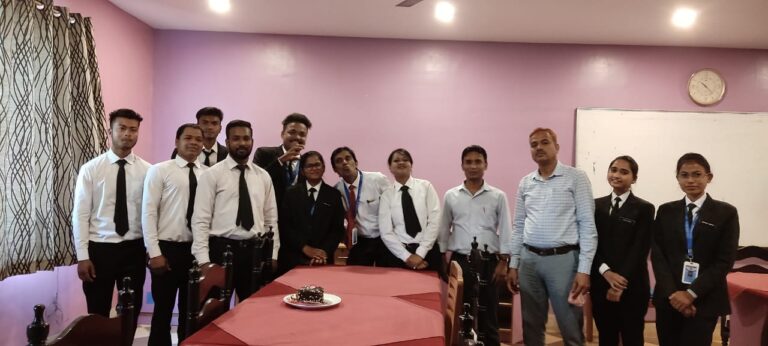 Students in formal uniforms posing with faculty inside an ISM Ranchi classroom