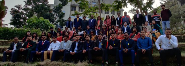 Students posing together outdoors during an ISM Ranchi campus event