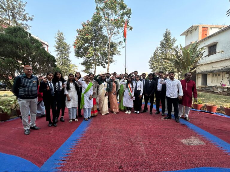 Students and staff gathered around the flagpole on the ISM Ranchi campus