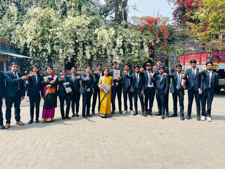 ISM Ranchi students and faculty posing for a group photograph beside campus greenery