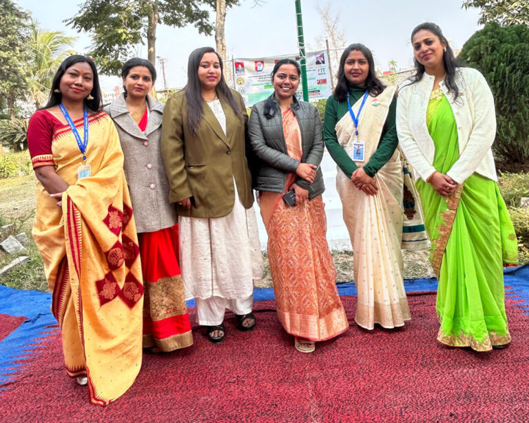 Faculty members posing together outdoors during an ISM Ranchi campus gathering