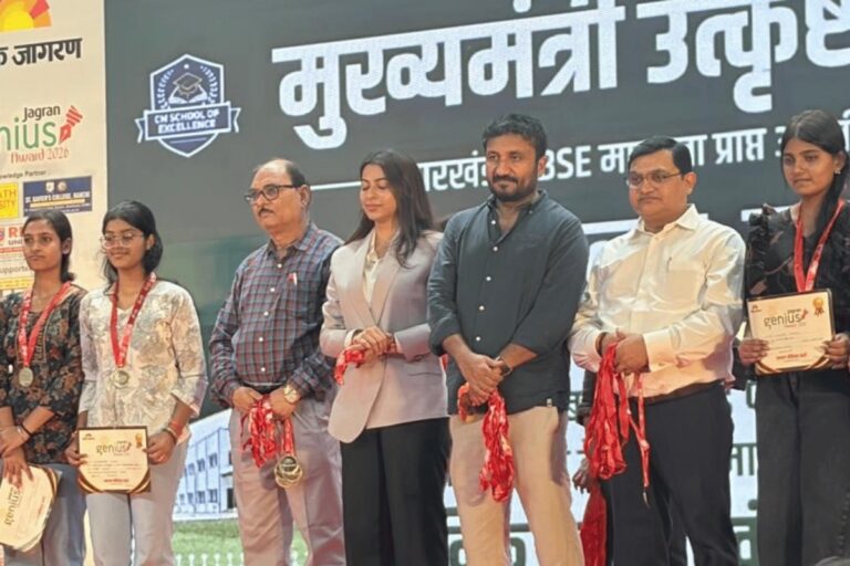 Guests presenting a memento on stage at an ISM Ranchi ceremony