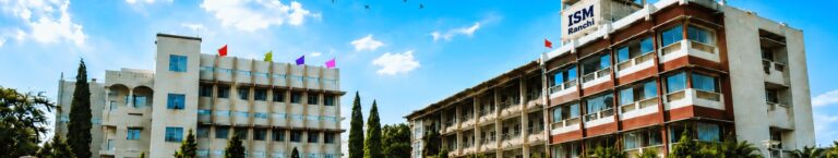 ISM Ranchi campus buildings and open courtyard beneath a blue sky